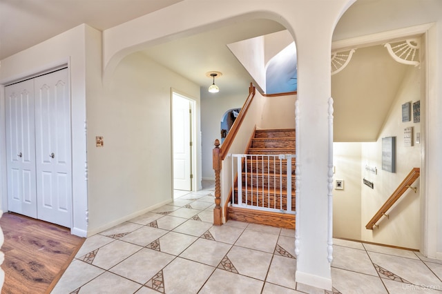 stairs featuring hardwood / wood-style floors