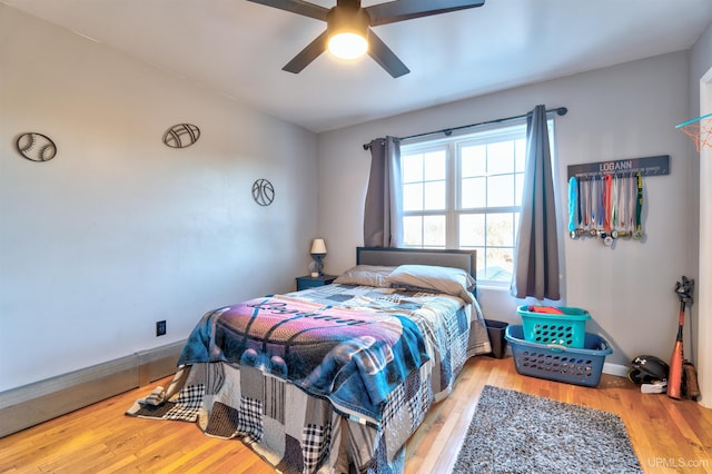 bedroom featuring ceiling fan and light wood-type flooring