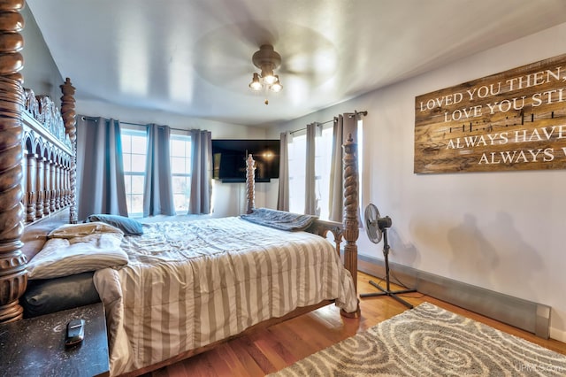 bedroom with hardwood / wood-style floors and ceiling fan