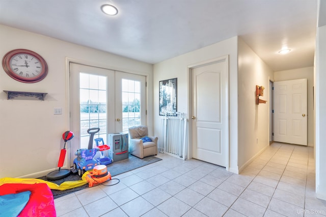 playroom with light tile patterned floors and french doors