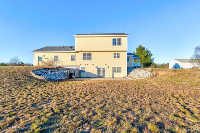 back of property with a patio area