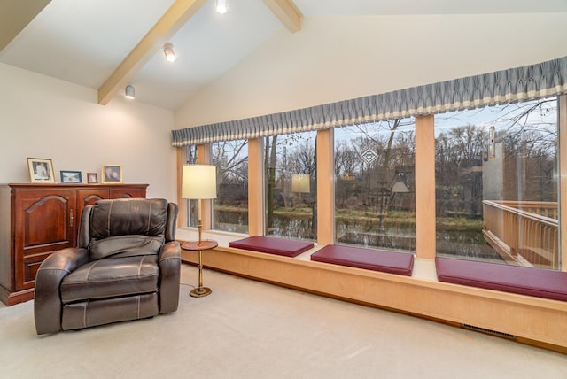 sunroom / solarium with a wealth of natural light and lofted ceiling with beams