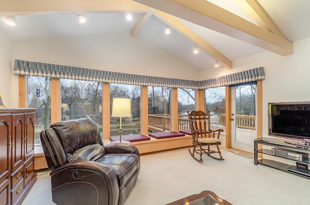 carpeted living room featuring beam ceiling and high vaulted ceiling