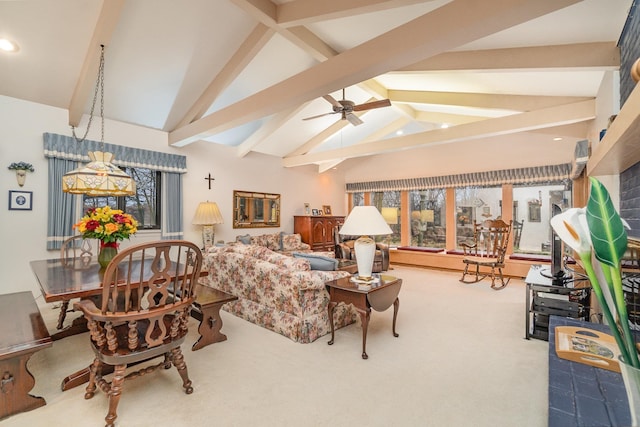 carpeted living room with lofted ceiling with beams and ceiling fan