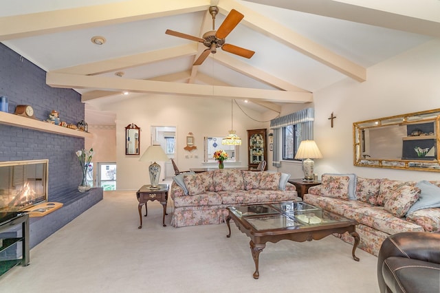 living room with carpet, plenty of natural light, beam ceiling, and a fireplace