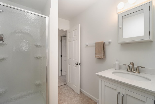 bathroom featuring tile patterned floors, vanity, and an enclosed shower