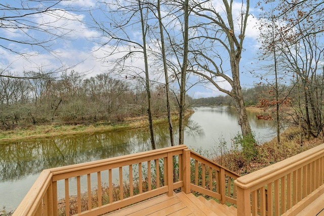 wooden deck featuring a water view