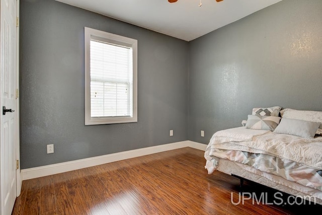 bedroom featuring ceiling fan and hardwood / wood-style flooring