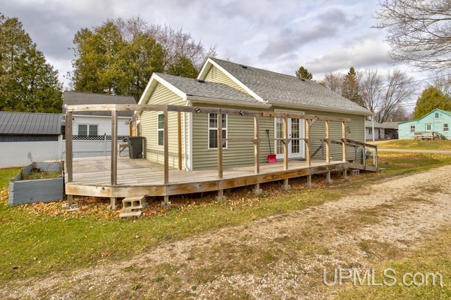 back of house featuring a deck