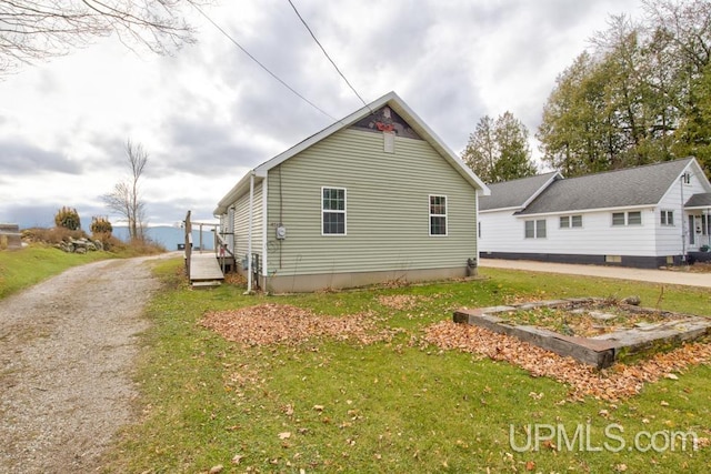 exterior space with a yard and a wooden deck