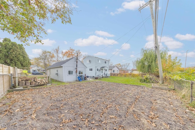 rear view of property with a yard