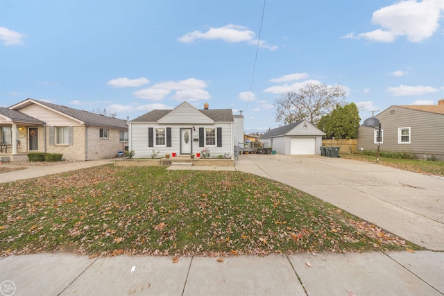 view of front facade featuring a garage, an outdoor structure, and a front yard