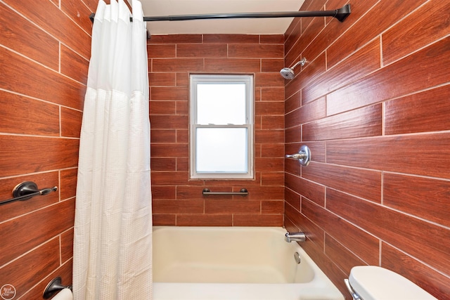 bathroom with wood walls and toilet