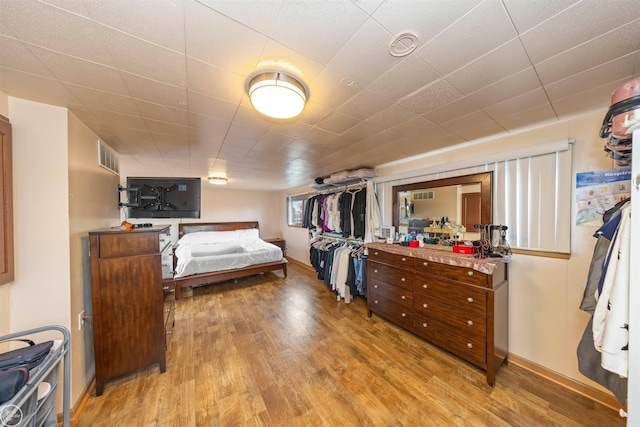 bedroom with light hardwood / wood-style floors