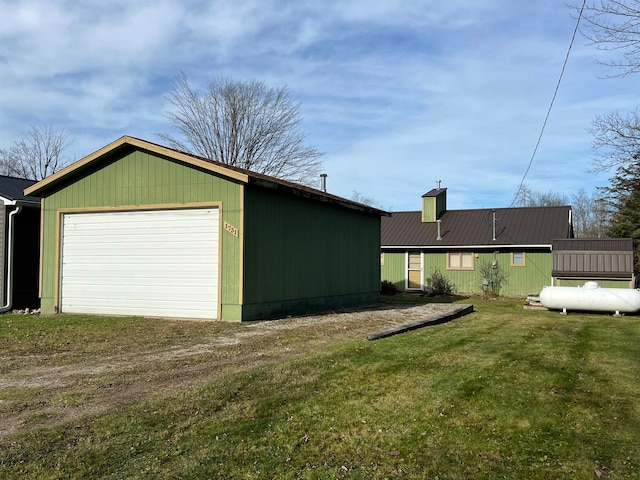 garage featuring a yard