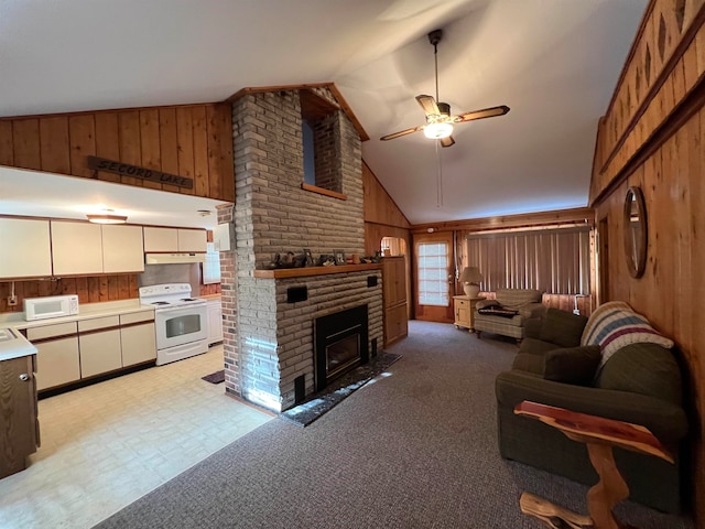 living room featuring a brick fireplace, high vaulted ceiling, ceiling fan, and wooden walls