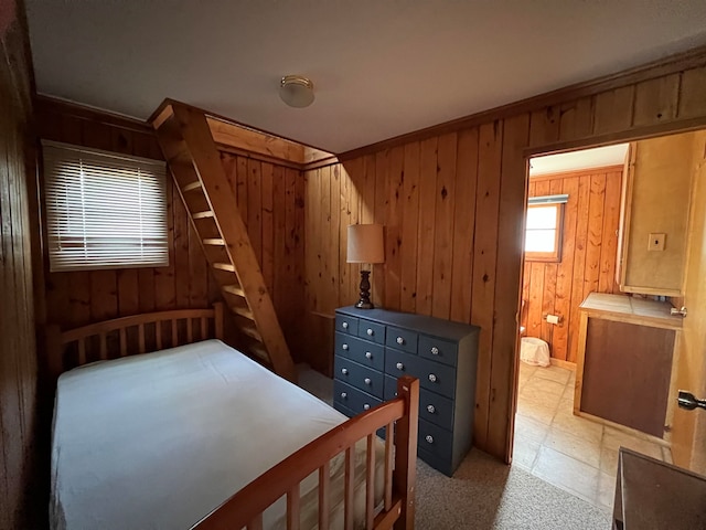 bedroom with wood walls