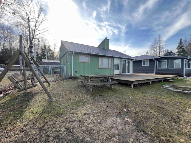 back of property with a wooden deck