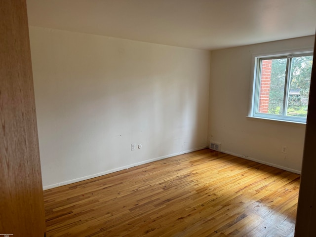 empty room with light wood-type flooring