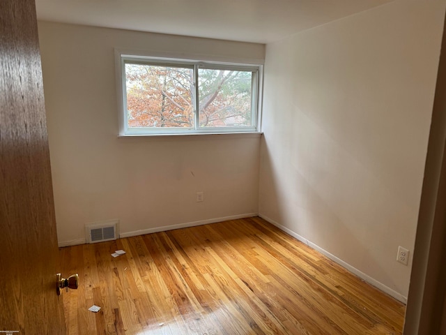 unfurnished room with light hardwood / wood-style flooring