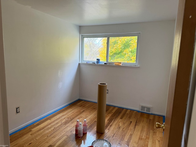 spare room featuring light hardwood / wood-style floors