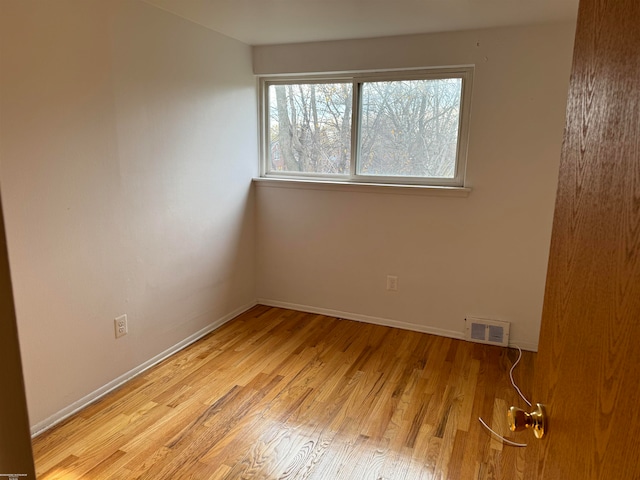 unfurnished room featuring light wood-type flooring