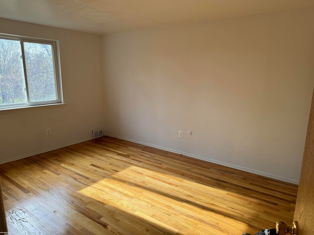 unfurnished room featuring light hardwood / wood-style floors