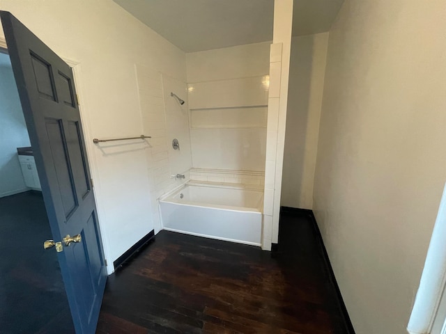 bathroom featuring shower / bathing tub combination and hardwood / wood-style flooring