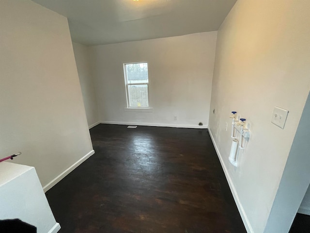 empty room featuring dark hardwood / wood-style floors