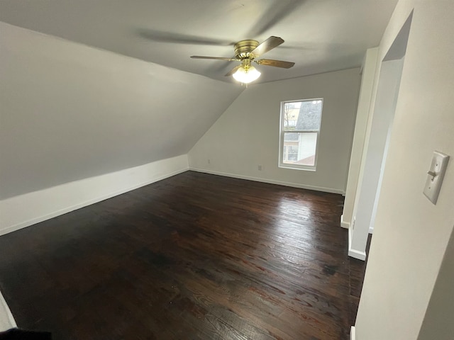 bonus room with ceiling fan, dark hardwood / wood-style flooring, and lofted ceiling