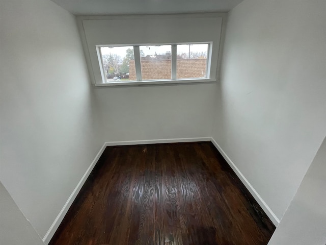 unfurnished room featuring dark hardwood / wood-style flooring