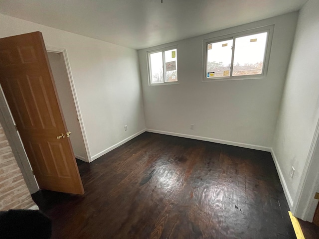 empty room featuring dark hardwood / wood-style floors