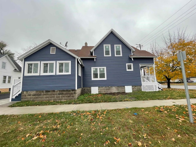 exterior space featuring a front lawn