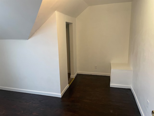 bonus room featuring dark hardwood / wood-style floors and lofted ceiling