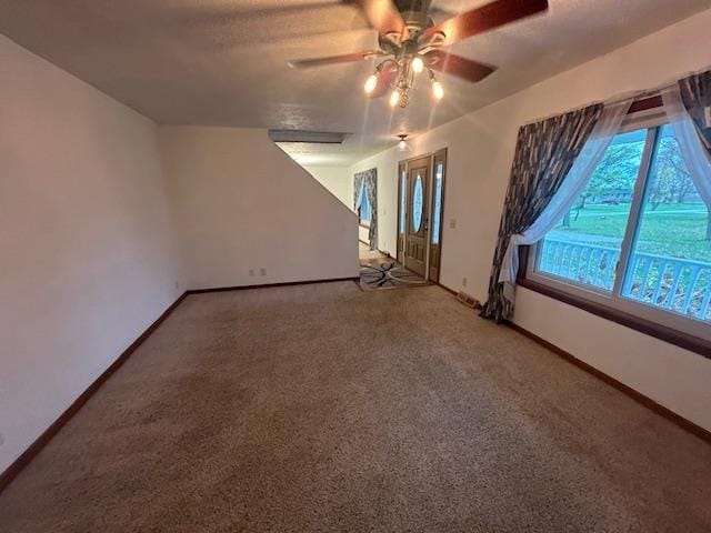 bonus room featuring ceiling fan and carpet floors