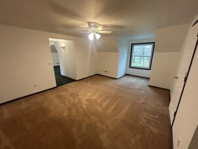 bonus room with carpet and ceiling fan