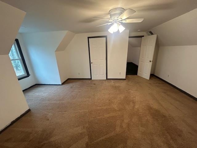 bonus room featuring carpet floors, vaulted ceiling, and ceiling fan