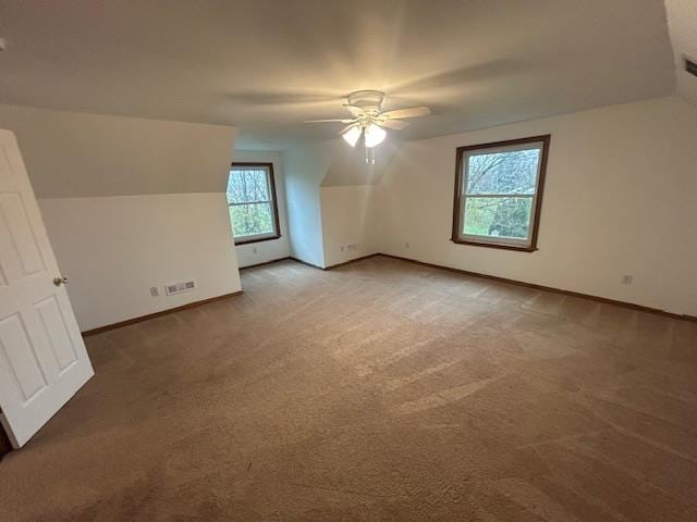 bonus room featuring carpet flooring, ceiling fan, and lofted ceiling