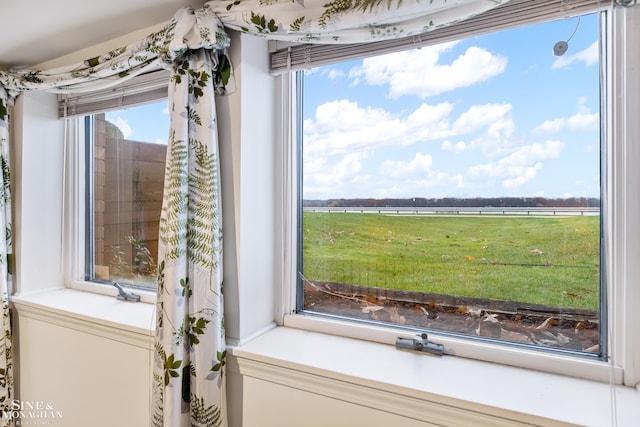 bathroom featuring a rural view