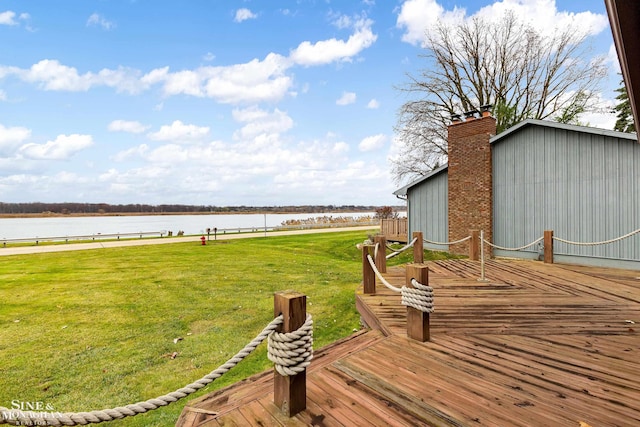 wooden deck with a yard and a water view