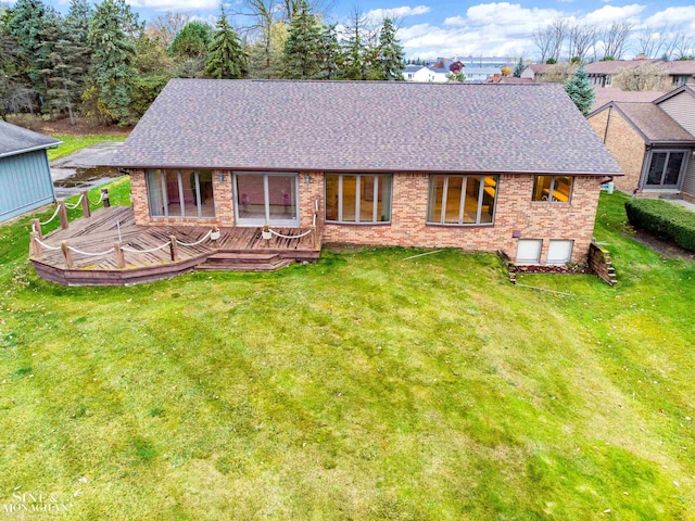 rear view of property featuring a yard