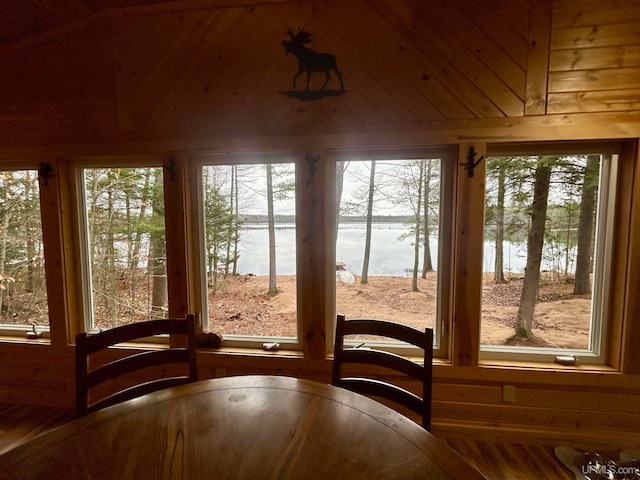 unfurnished sunroom with a healthy amount of sunlight and a water view