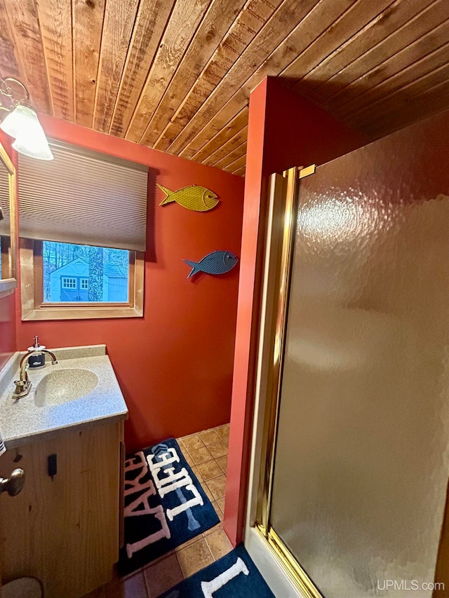 bathroom with tile patterned flooring, vanity, wood ceiling, and a shower with door