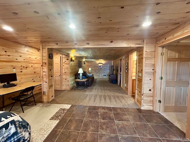 interior space featuring wood ceiling and wooden walls