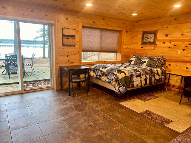 bedroom featuring access to outside, multiple windows, wood walls, and wooden ceiling