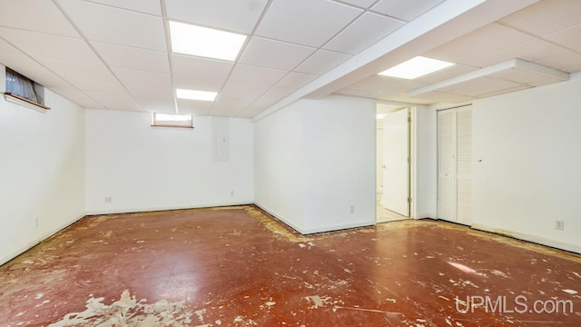 basement featuring a drop ceiling