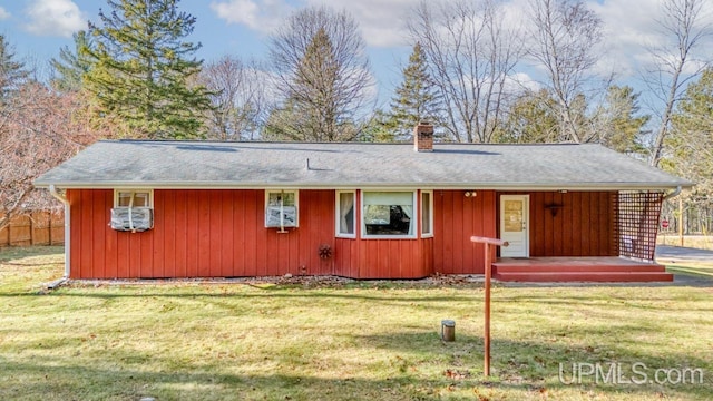 ranch-style home with a front lawn