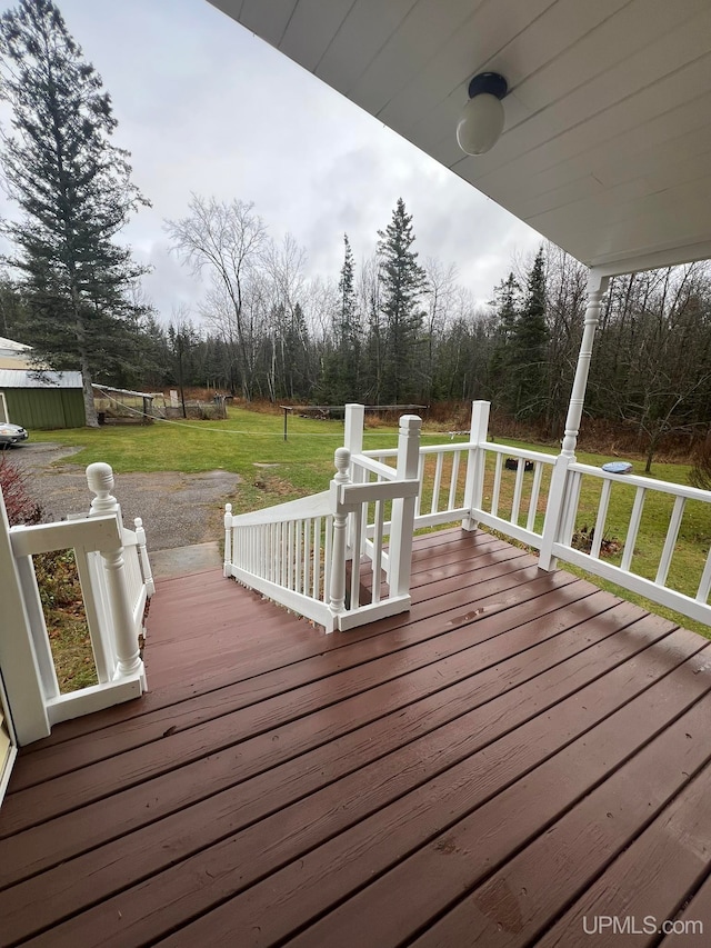 wooden deck with a yard