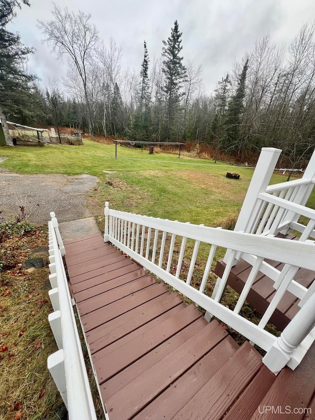 deck featuring a lawn