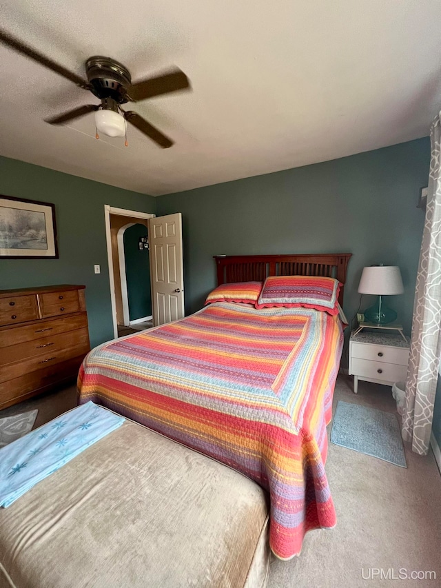 bedroom with ceiling fan and carpet floors